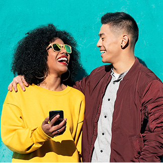 Young couple using cellphone
