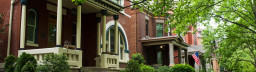 Victorian style homes with pretty, green trees